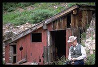 Glenn Dalrymple in front of abandoned millhouse in Ouray, CO